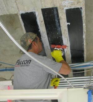 Applying CFRP strips to underneath of beam