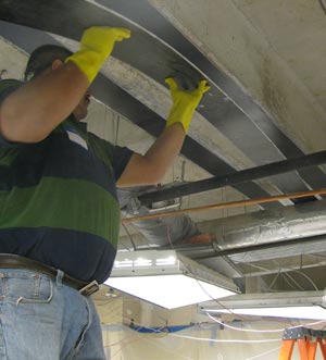 Threading CFRP strip over duct work